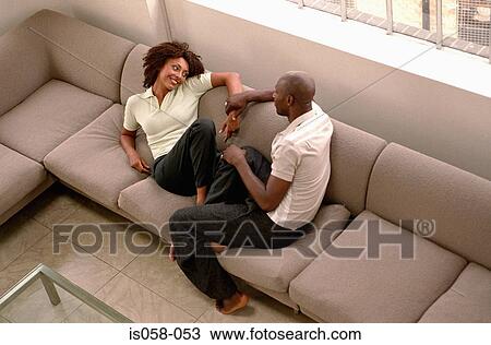 Couple on couch View Large Photo Image Stock Image - Couple on couch. Fotosearch