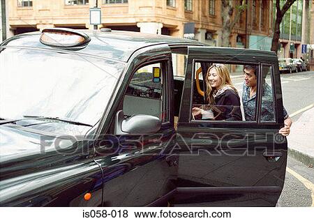 Couple taking taxi View Large Photo Image Stock Photo - Couple taking taxi. Fotosearch