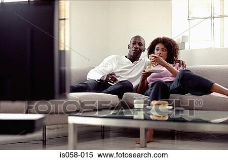 Stock Photography - Couple watching TV. Fotosearch