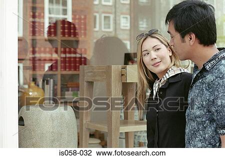 Stock Image - Couple window-shopping. Fotosearch