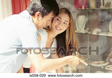Stock Photo - Couple window-shopping. Fotosearch