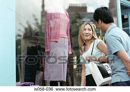 Stock Photograph - Couple window-shopping. Fotosearch