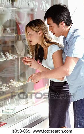 Couple window-shopping View Large Photo Image Stock Photography - Couple window-shopping. Fotosearch