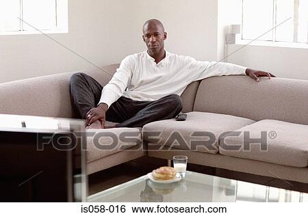 Man watching TV View Large Photo Image Stock Photograph - Man watching TV. Fotosearch