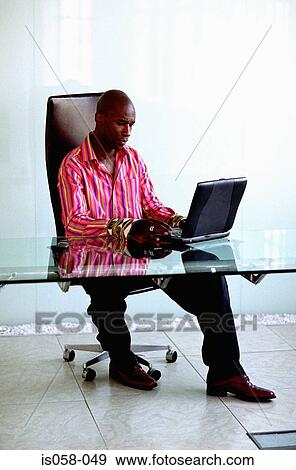 Stock Photo - Man with laptop. Fotosearch