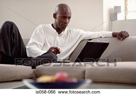 Stock Photograph - Man with laptop. Fotosearch