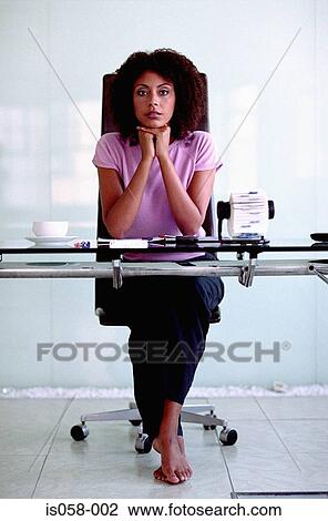 Woman at desk View Large Photo Image Stock Image - Woman at desk. Fotosearch