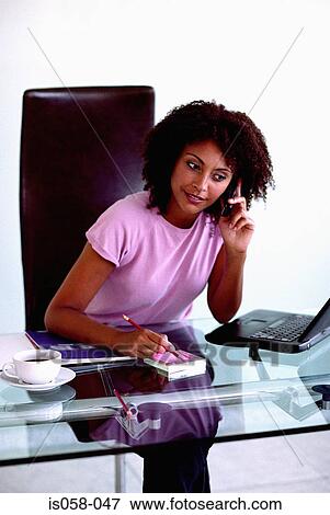 Woman at desk View Large Photo Image Stock Photo - Woman at desk. Fotosearch