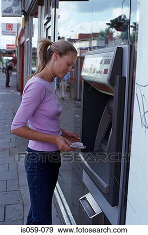 Stock Photo - Girl cashing money. Fotosearch