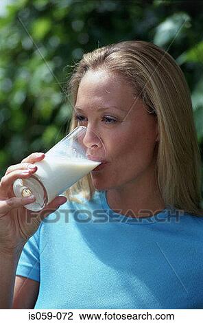 Stock Image - Girl drinking milk. Fotosearch