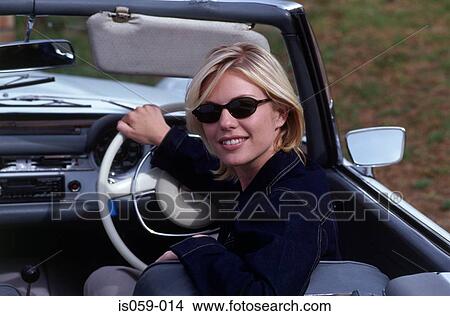 Picture - Girl driving car. Fotosearch