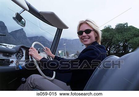 Stock Photography - Girl driving car. Fotosearch