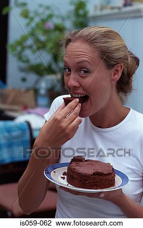 Girl eating chocolate cake View Large Photo Image Stock Image - Girl eating chocolate cake. Fotosearch