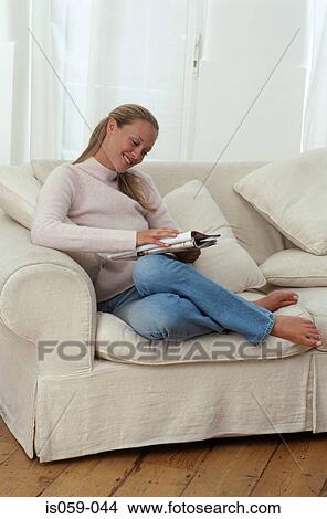 Girl reading magazine View Large Photo Image Picture - Girl reading magazine. Fotosearch