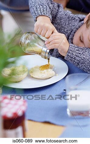Boy at breakfast View Large Photo Image Stock Photo - Boy at breakfast. Fotosearch