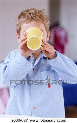 Boy drinking tea View Large Photo Image Stock Photo - Boy drinking tea. Fotosearch