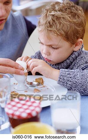Boy eating breakfast View Large Photo Image Stock Photograph - Boy eating breakfast. Fotosearch