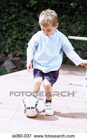Boy playing ball View Large Photo Image Stock Photo - Boy playing ball. Fotosearch