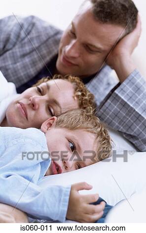 Family in bed View Large Photo Image Stock Image - Family in bed. Fotosearch