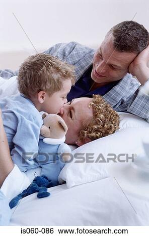Family in bed View Large Photo Image Stock Photograph - Family in bed. Fotosearch