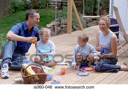 Stock Photograph - Family in garden. Fotosearch