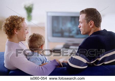 Family watching TV View Large Photo Image Picture - Family watching TV. Fotosearch
