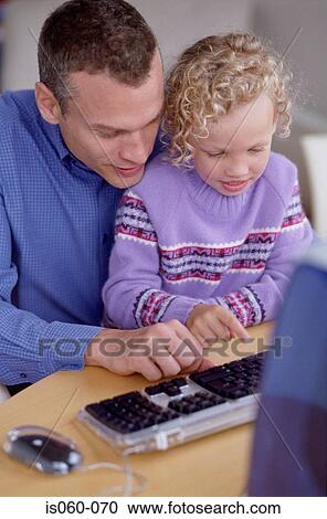 Father and daughter at computer View Large Photo Image Stock Image - Father and daughter at computer. Fotosearch