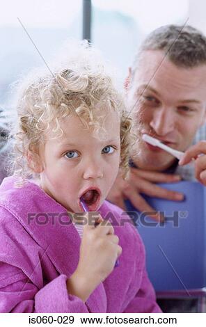 Father and daughter brushing teeth View Large Photo Image Stock Photo - Father and daughter brushing teeth. Fotosearch