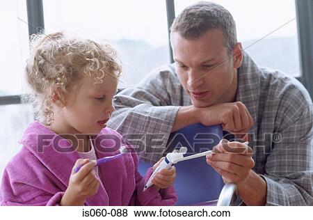 Stock Photo - Father and daughter brushing teeth. Fotosearch