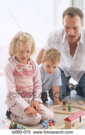 Father and kids playing View Large Photo Image Stock Photography - Father and kids playing. Fotosearch