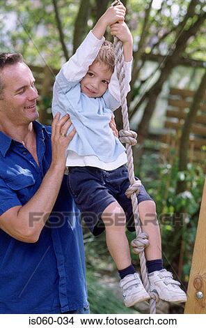 Father and son outdoors View Large Photo Image Picture - Father and son outdoors. Fotosearch