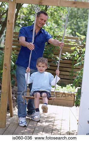 Father and son outdoors View Large Photo Image Stock Photograph - Father and son outdoors. Fotosearch