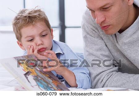 Stock Photo - Father and son reading. Fotosearch
