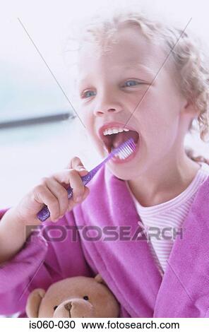 Girl brushing teeth View Large Photo Image Stock Image - Girl brushing teeth. Fotosearch
