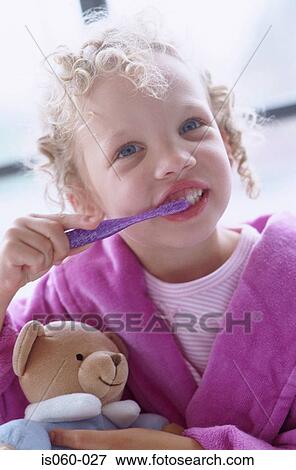 Stock Photo - Girl brushing teeth. Fotosearch