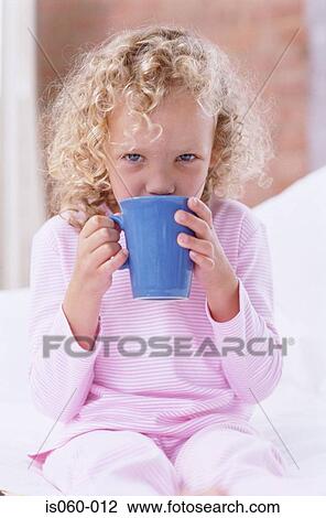 Stock Image - Girl drinking tea. Fotosearch