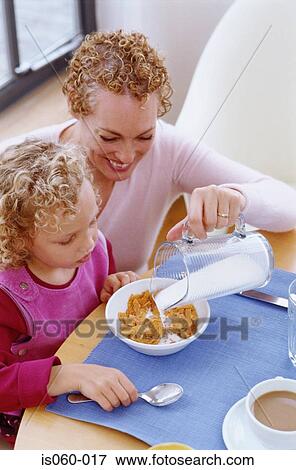 Mother and daughter at breakfast View Large Photo Image Stock Photo - Mother and daughter at breakfast. Fotosearch