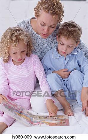 Mother and kids reading View Large Photo Image Stock Photo - Mother and kids reading. Fotosearch