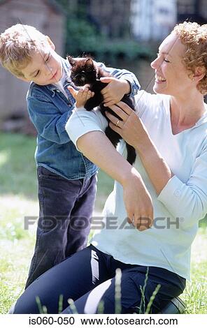 Stock Image - Mother and son with cat. Fotosearch