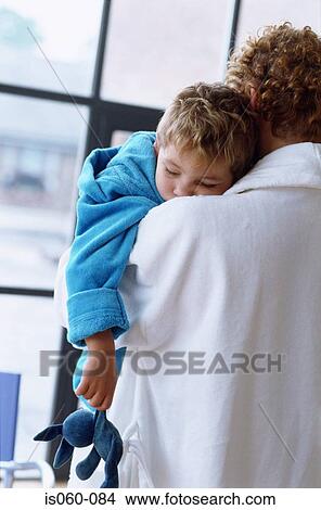 Mother carrying son View Large Photo Image Picture - Mother carrying son. Fotosearch