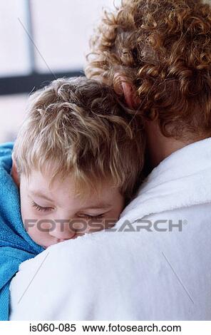 Mother carrying son View Large Photo Image Stock Photography - Mother carrying son. Fotosearch