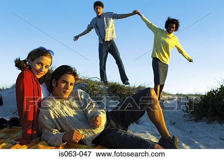 Stock Photo - Couples on beach. Fotosearch