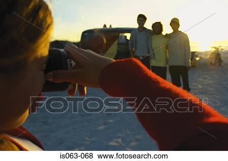 Stock Photo - Girl taking picture. Fotosearch