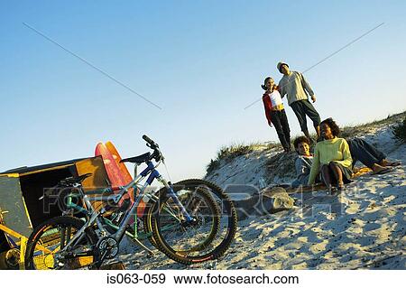Stock Photo - People on beach. Fotosearch