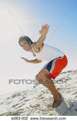 Surfer on beach View Large Photo Image Stock Image - Surfer on beach. Fotosearch