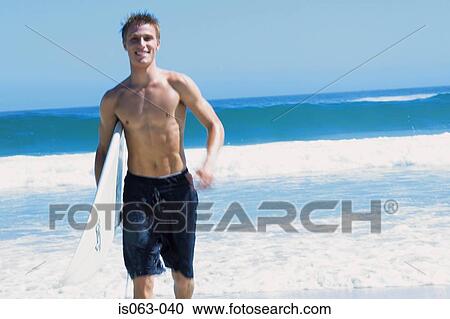 Surfer on beach View Large Photo Image Stock Image - Surfer on beach. Fotosearch