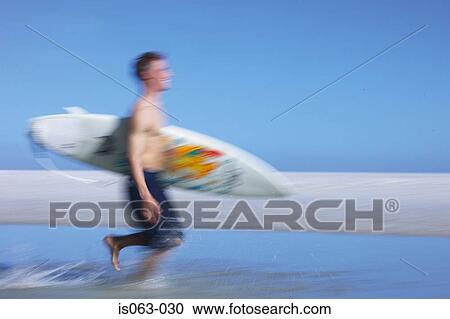 Surfer running View Large Photo Image Stock Image - Surfer running. Fotosearch