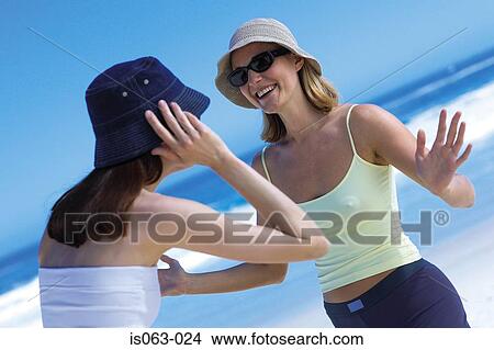 Two women on beach View Large Photo Image Picture - Two women on beach. Fotosearch