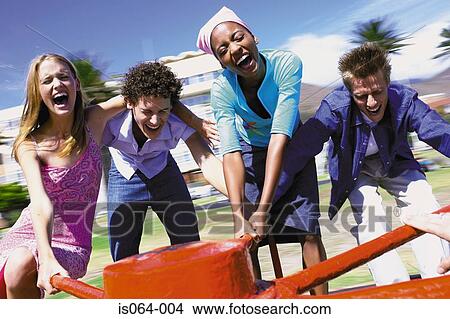 Group spinning roundabout View Large Photo Image Picture - Group spinning roundabout. Fotosearch