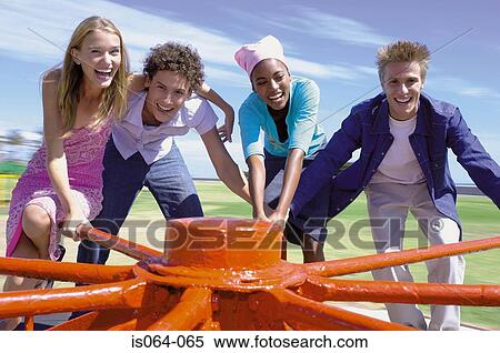 Group spinning roundabout View Large Photo Image Stock Photography - Group spinning roundabout. Fotosearch